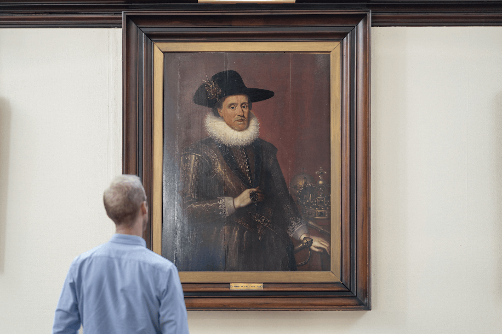 A member looking at a portrait of James VI